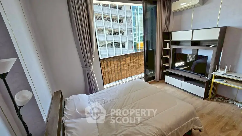 Modern bedroom with balcony view in urban apartment