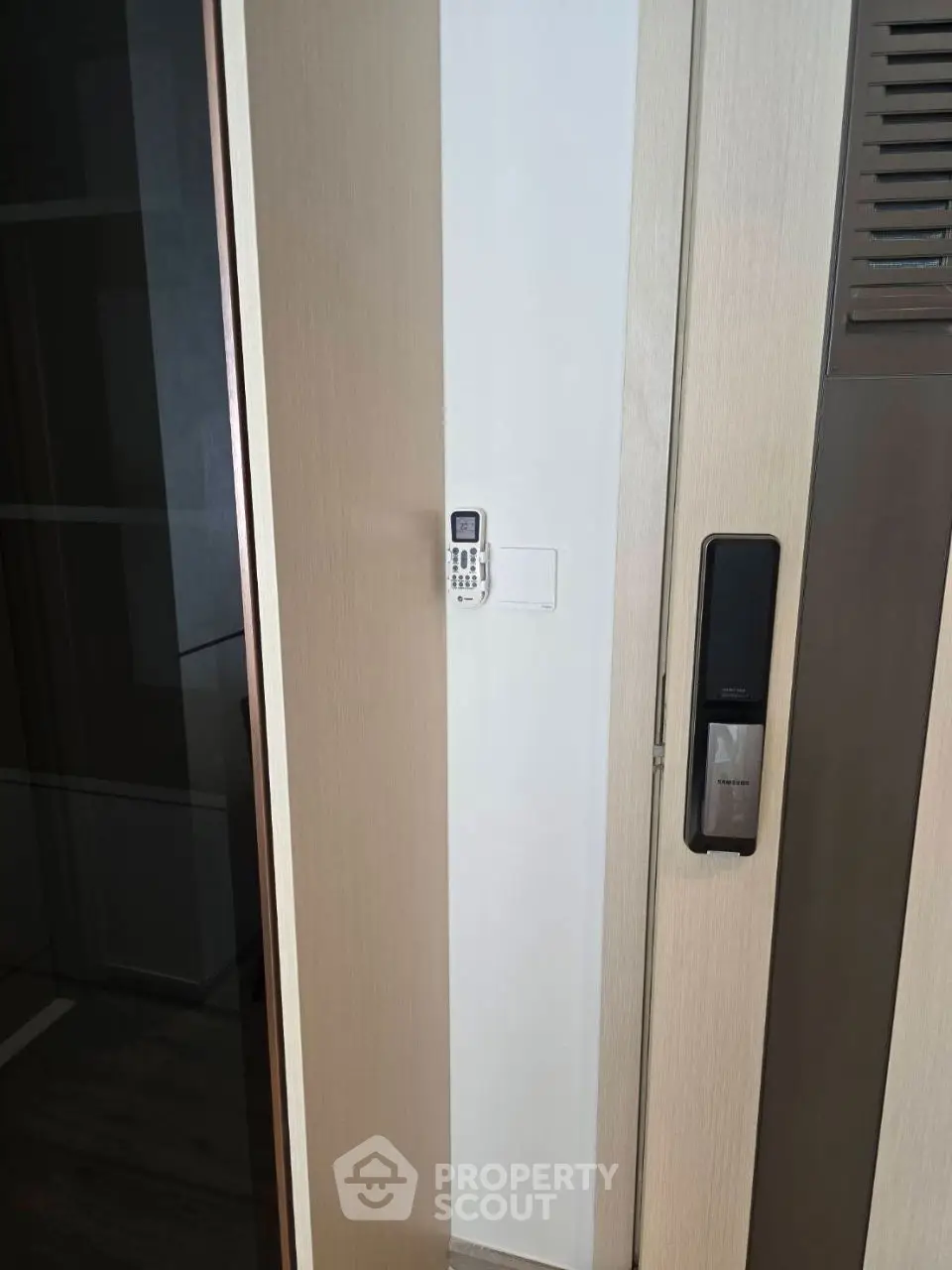 Modern apartment entrance with smart lock and intercom system