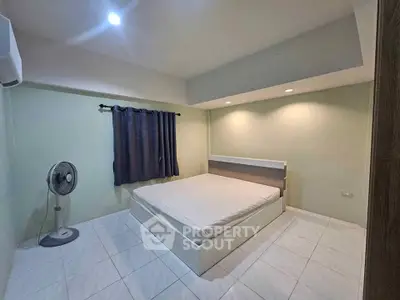 Spacious bedroom with modern design and ample natural light