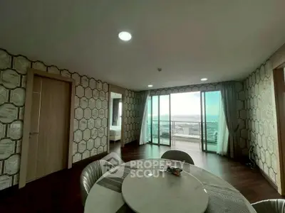Spacious living room with panoramic city view and modern decor