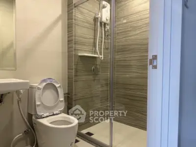 Modern bathroom with glass shower and sleek tile design