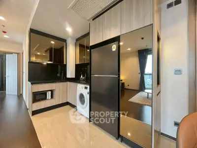 Modern kitchen with sleek appliances and open layout in stylish apartment
