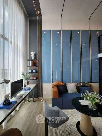 Modern living room with high ceilings and stylish decor
