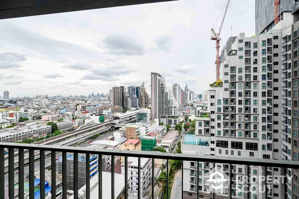 Stunning cityscape view from high-rise balcony with modern architecture and urban skyline.