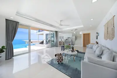 Luxurious open-plan living room with ocean view and modern decor