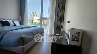 Modern bedroom with large window and stylish decor