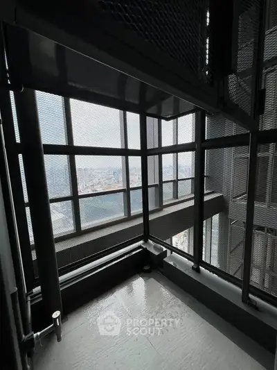 Modern balcony with city view and sleek metal railing