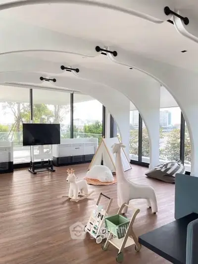 Spacious modern living room with large windows and unique ceiling design