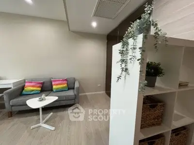 Modern living room with stylish decor and cozy seating area, perfect for relaxation and entertaining.