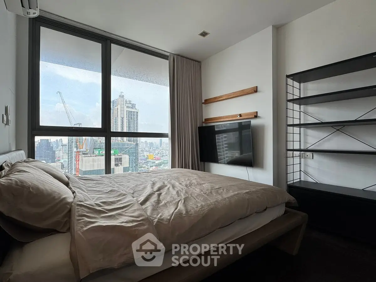 Modern bedroom with city view and stylish furnishings