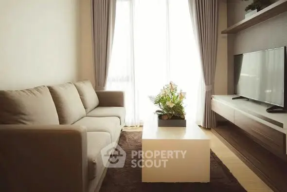 Modern living room with cozy sofa, stylish TV unit, and elegant decor.