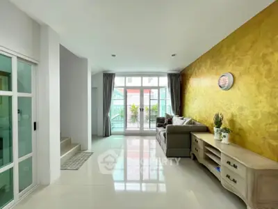 Spacious modern living room with stylish decor and large windows