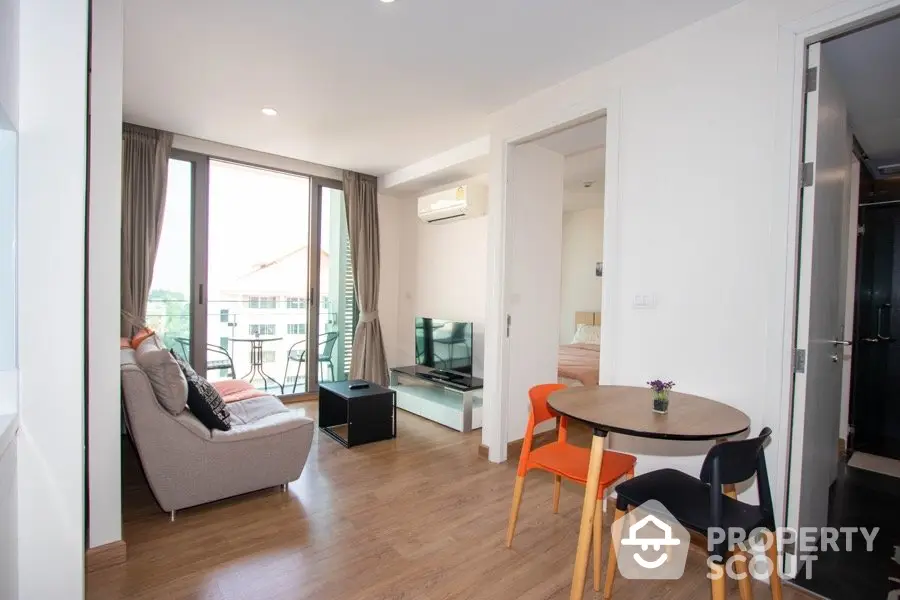 Modern living room with balcony view in stylish apartment