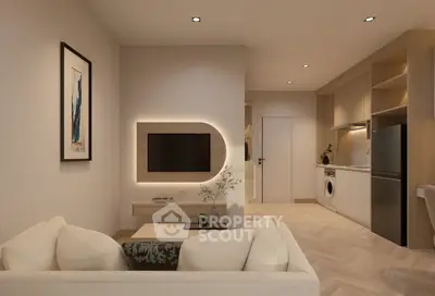 Modern living room with open kitchen, featuring sleek design and integrated appliances.