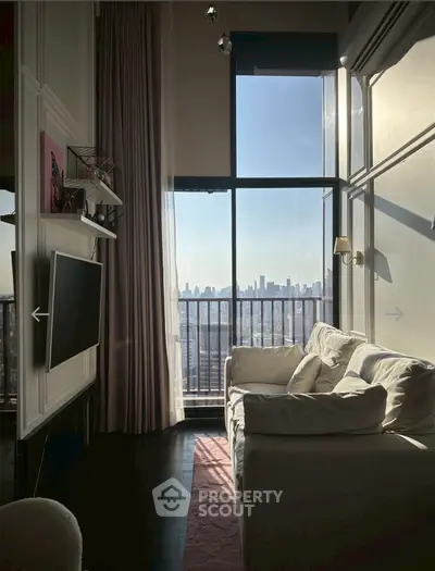 Chic living room with floor-to-ceiling windows and stunning city view