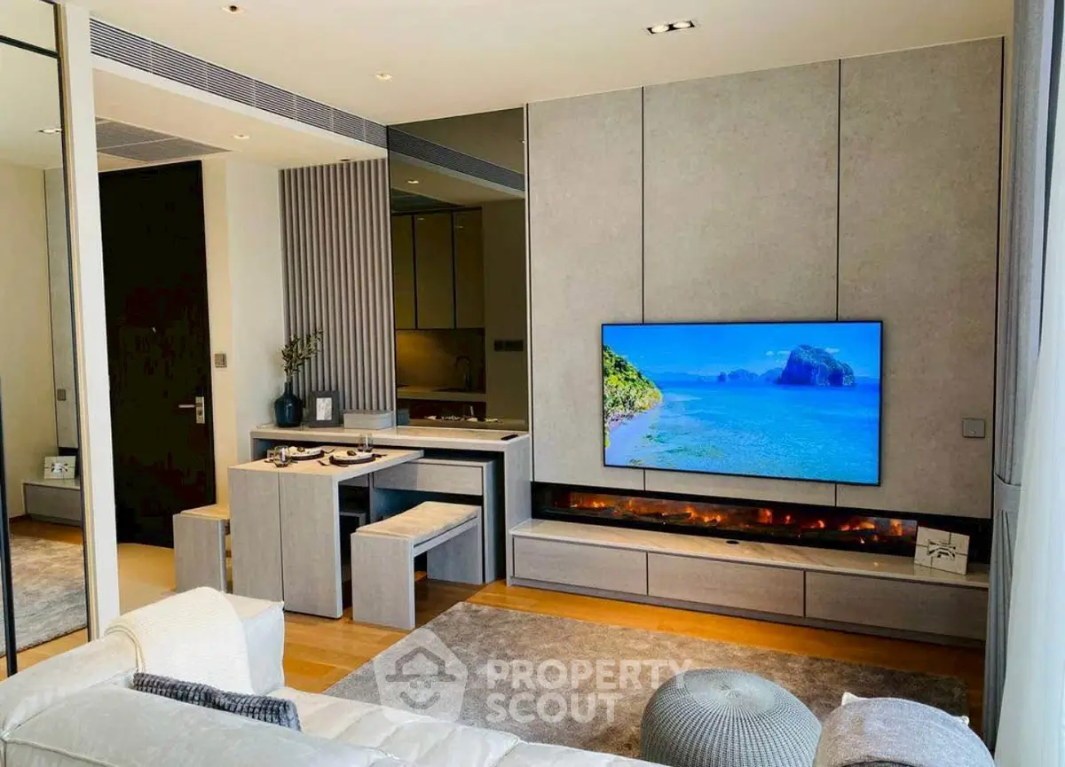 Modern living room with stylish decor and large wall-mounted TV