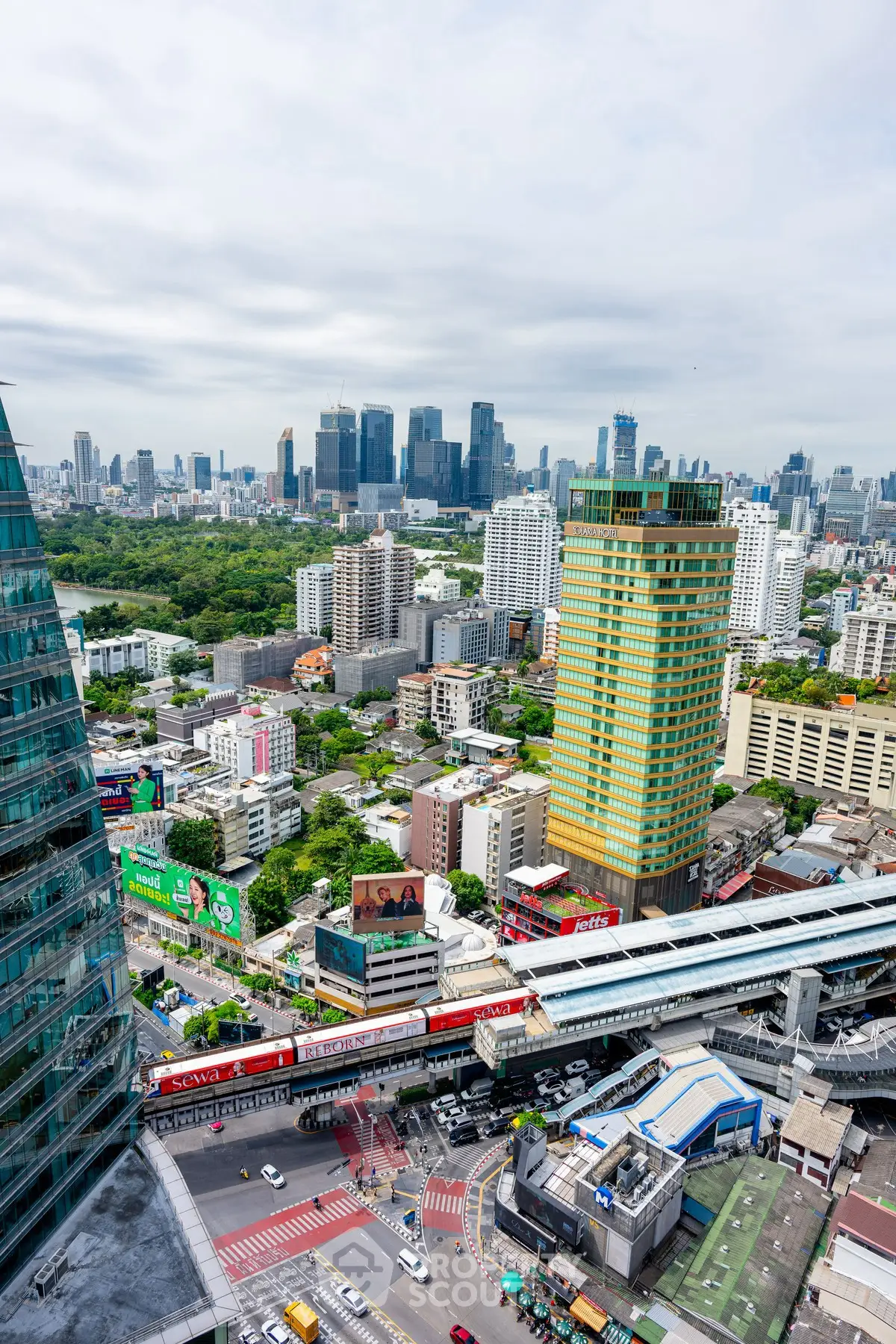 Stunning cityscape view showcasing modern skyscrapers and urban landscape with lush greenery.