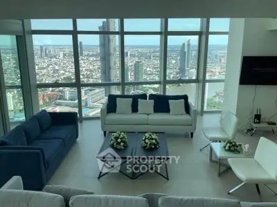 Luxurious high-rise living room with panoramic city views and modern furnishings.