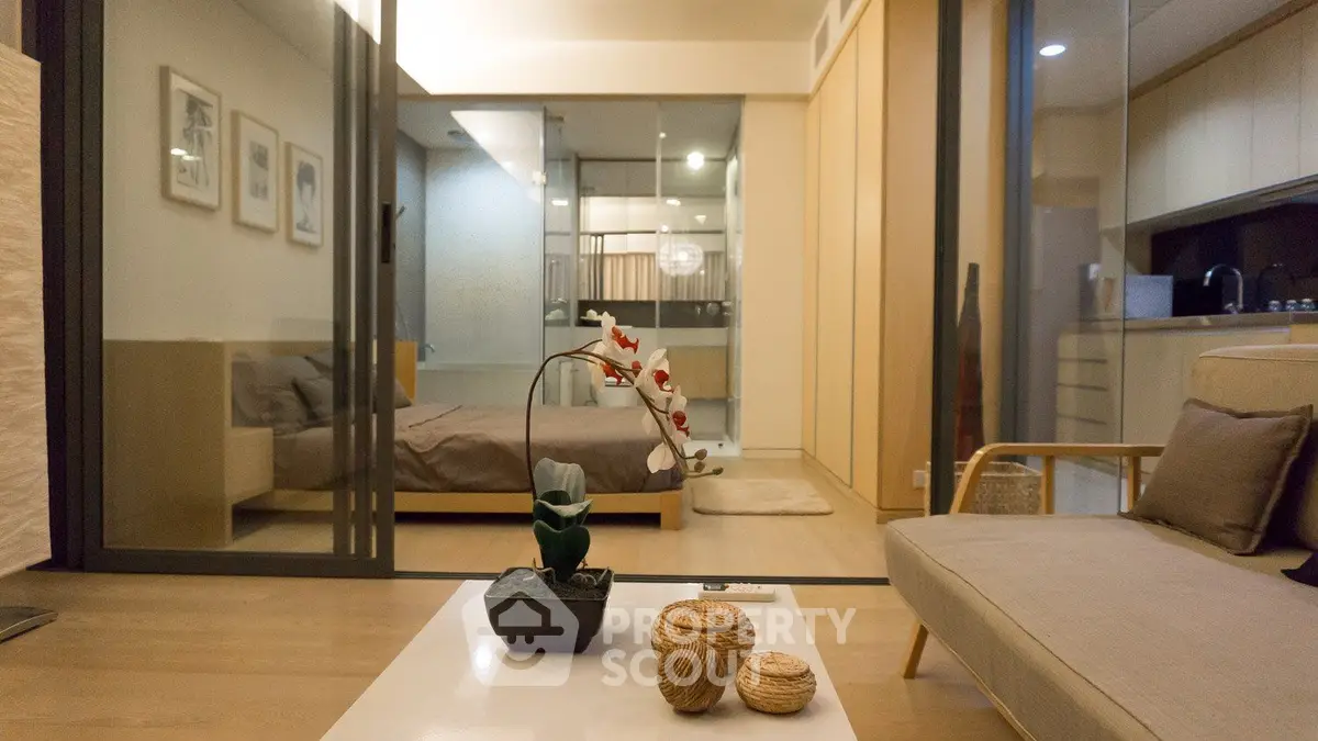 Modern apartment interior with open layout connecting living room and bedroom