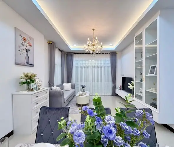 Elegant living room with chandelier and modern decor