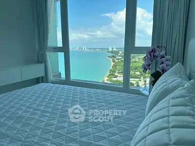 Luxurious bedroom with stunning ocean view and modern decor