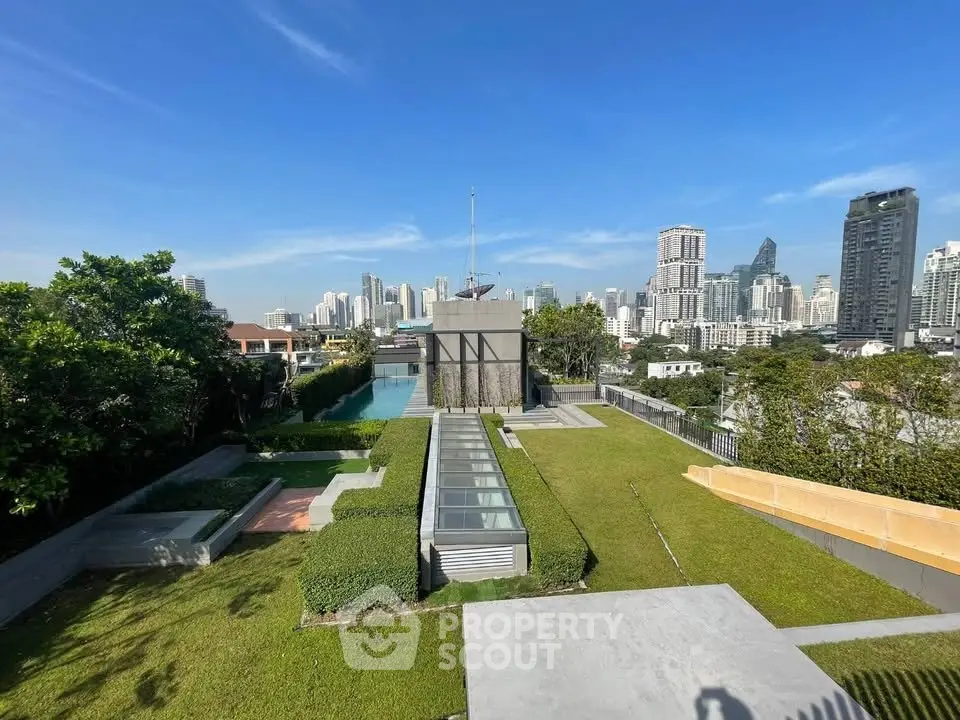 Stunning rooftop garden with city skyline view, perfect for urban living.