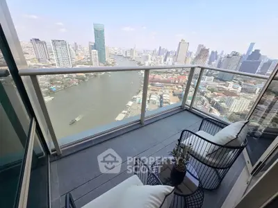 Stunning high-rise balcony with breathtaking city and river views, perfect for relaxation and urban living.