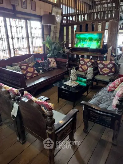 Charming rustic living room with wooden furniture and vibrant decor