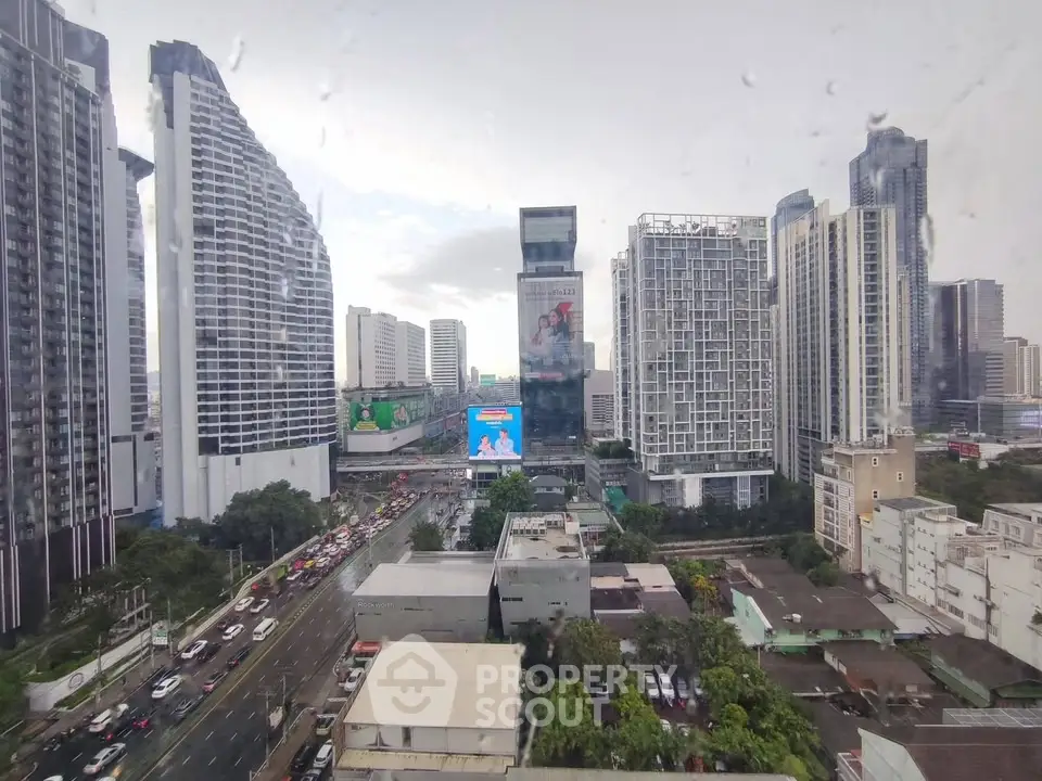 Stunning cityscape view showcasing modern high-rise buildings and bustling urban streets.