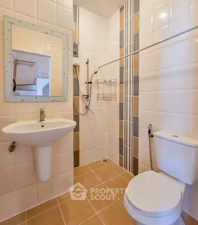 Modern bathroom with sleek fixtures and stylish tile design, perfect for contemporary living.