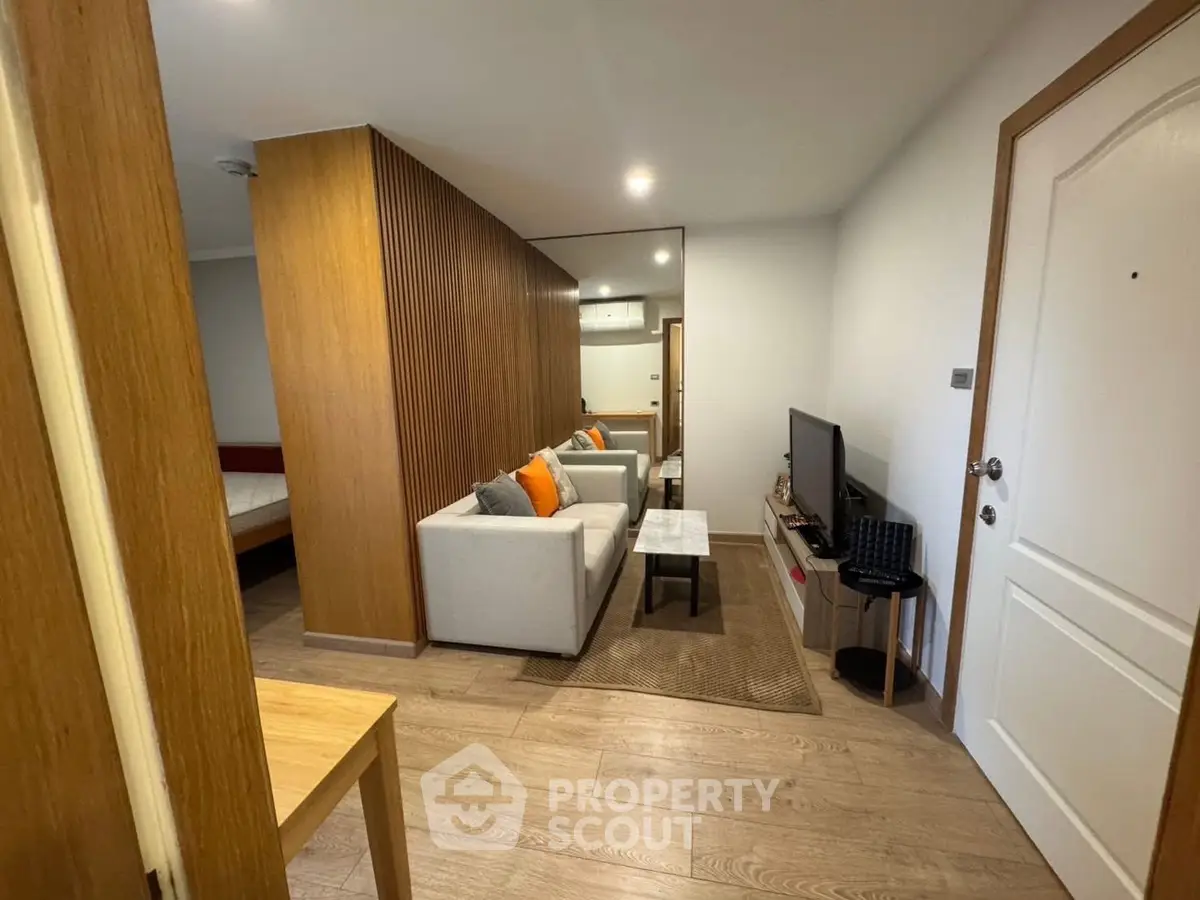 Modern living room with wooden accents and cozy seating area