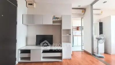 Modern living room with sleek furniture and wooden flooring