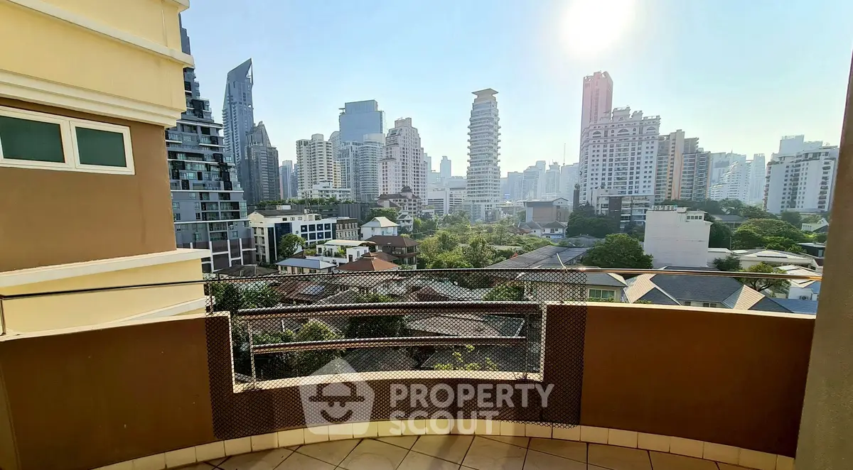 Stunning cityscape view from a spacious balcony in a high-rise apartment, perfect for urban living.