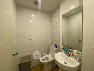 Modern bathroom with sleek fixtures and stylish tile design