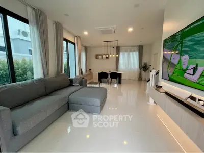 Spacious modern living room with sleek furniture and large windows