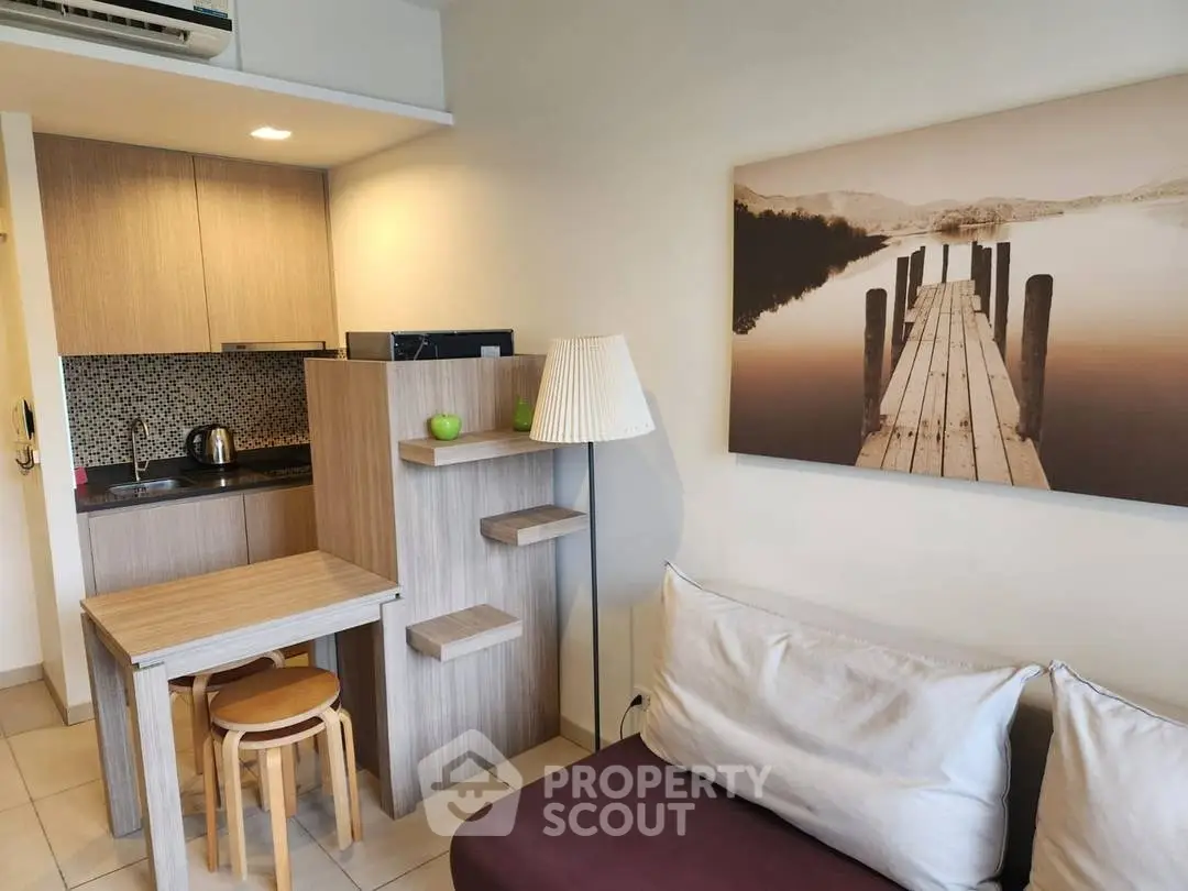 Cozy living room with modern kitchenette and stylish decor