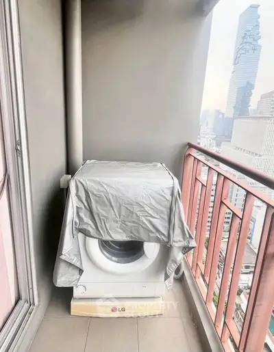 Urban balcony with washing machine and city skyline view
