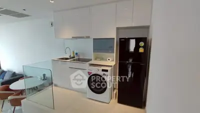 Modern kitchen with sleek appliances and open layout in stylish apartment