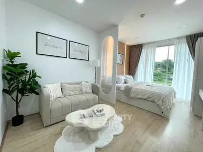 Modern studio apartment with cozy living area and stylish bedroom