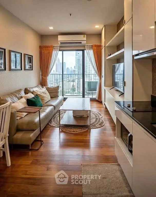 Modern living room with city view, featuring sleek furniture and open layout.