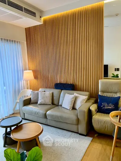 Modern living room with stylish wood paneling and cozy seating area