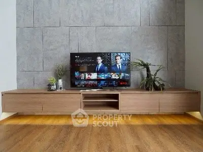 Modern living room with sleek wooden TV stand and stylish decor