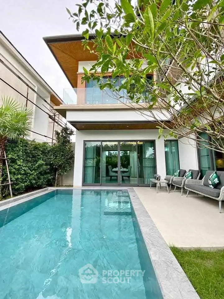 Luxurious modern home with private pool and lush garden, perfect for relaxation and entertaining.