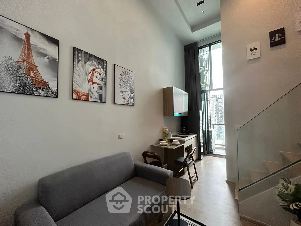 Modern living room with high ceiling and stylish decor in a contemporary apartment