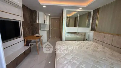 Modern studio apartment with stylish decor and mirrored wardrobe