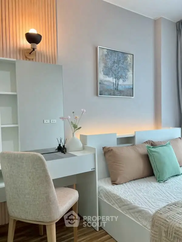Modern bedroom with stylish decor and cozy ambiance, featuring a comfortable bed and elegant lighting.