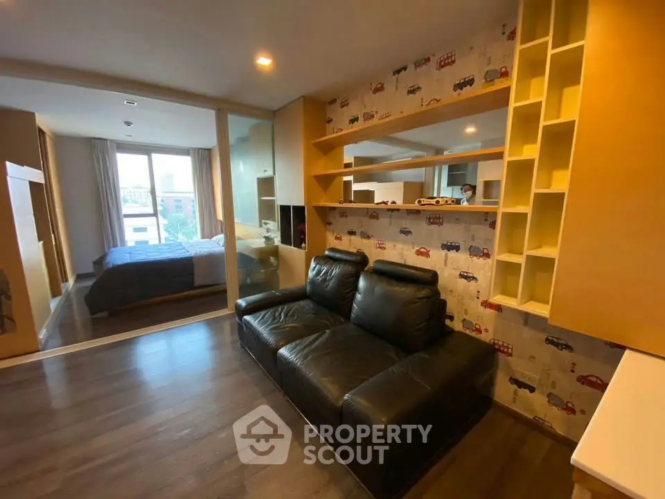 Modern studio apartment with stylish living area and cozy bedroom