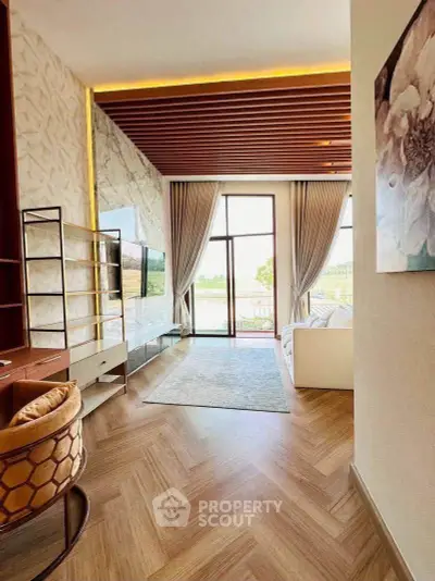 Luxurious living room with elegant decor and stunning view through large windows.