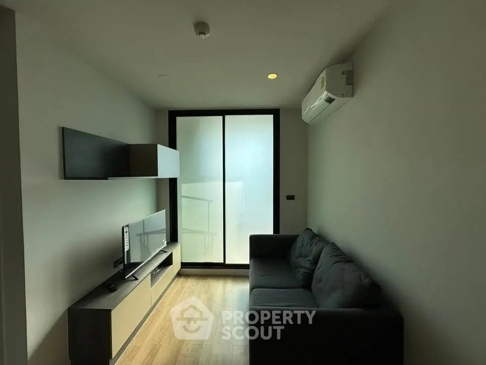 Modern living room with sleek furniture and air conditioning