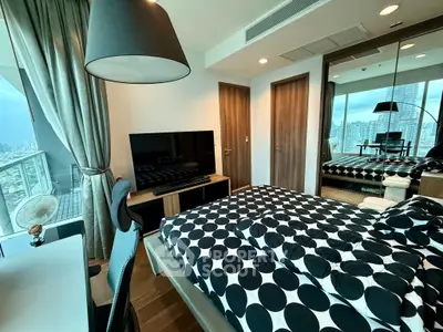 Modern bedroom with city view, stylish decor, and large windows in a high-rise apartment.